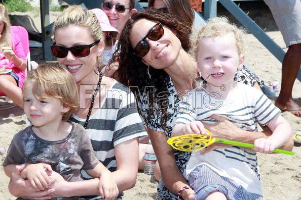 Kathleen Robertson, her son William and Actress Minnie Driver with her son Henry