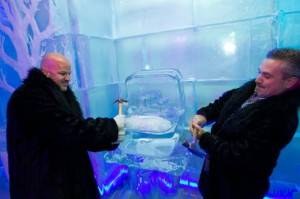 Guests of Minus5 Ice Bar Guests of Minus5 Ice Bar help dismantle and ice replica of Kim Kardashian's 20-plus carat engagement ring ice sculpture.