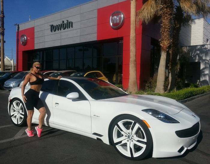 Coco Austin with her new, specially ordered Fisker Karma at Towbin Automotive.