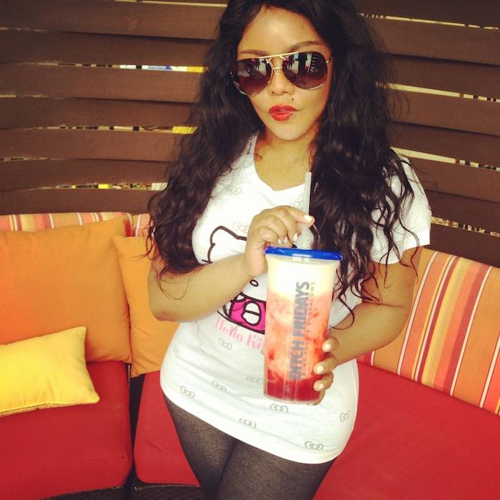 Lil Kim sips on Miami Vice cocktail while hanging out in her cabana at the Palms Pool. 