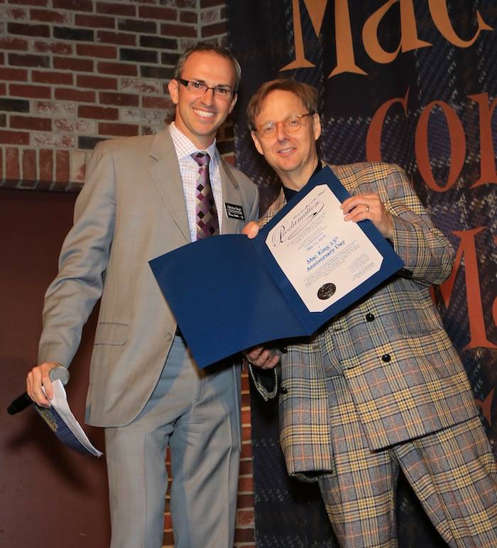 Christian Stuart, Harrah’s regional vice president and assistant general manager presents Comedy-Magician Mac King with a proclamation from Mayor Carolyn G. Goodman naming May 11, 2013 “Mac King 13th Anniversary Day” in Las Vegas. Photos: Gabe Ginsberg 