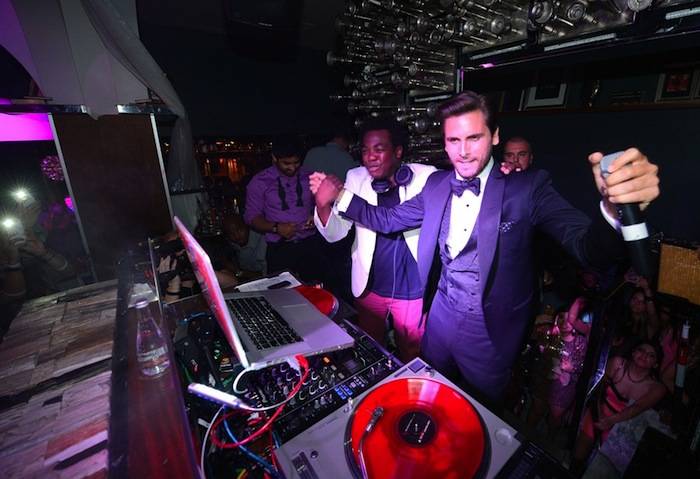 Scott Disick raps with DJ Reach at Hyde Bellagio. Photo: Jeff Bottari/Getty