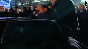 Photo of Berlusconi after attack via CNN.com