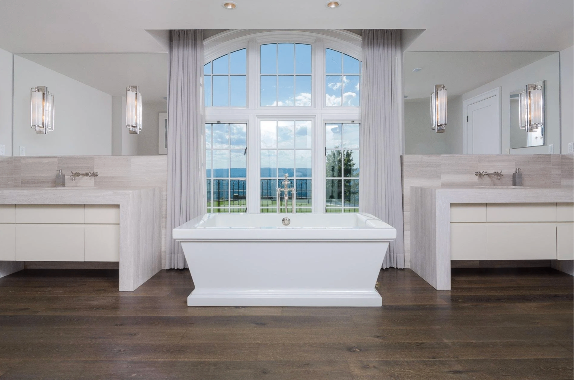 Mayflower My Flower — primary bathroom with freestanding tub and arched window, Avon, Connecticut, by Tammy Randall Wood / Interior Archaeology