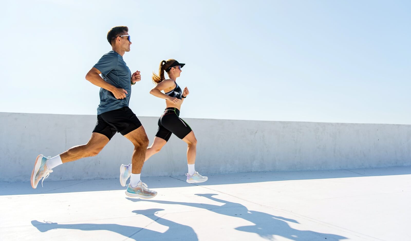couple running together on a sunny day, enjoying outdoor fitness and healthy lifestyle